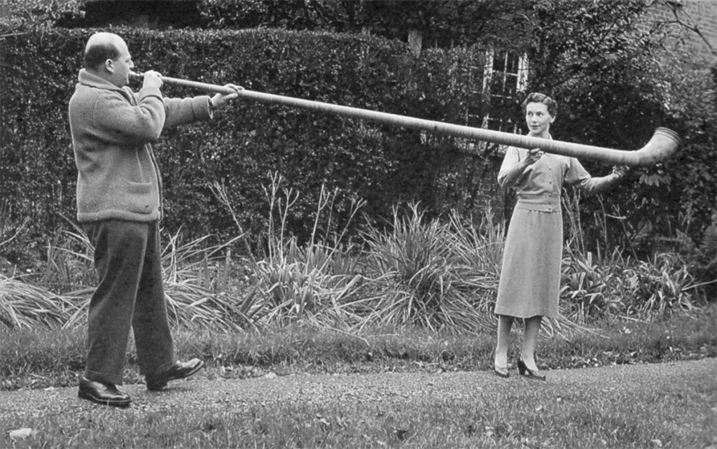 Gerard and Annetta in the garden with the Alphorn